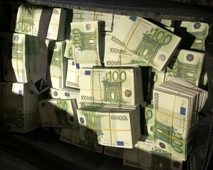 A photo of a suitcase filled with euros