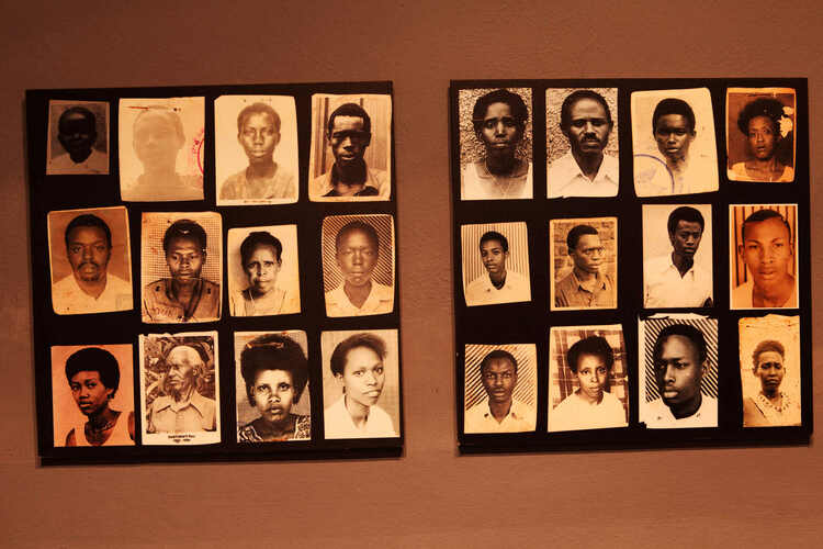 Two posters of multiple black-and-white photos of young people, displayed on a wall