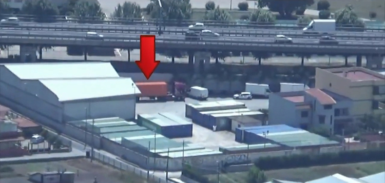 The fake orange container can be seen with an arrow pointing to it