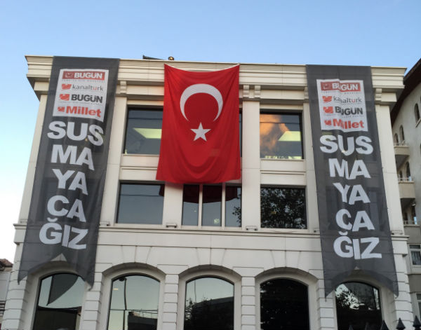 Protest flags against raids on Koza Ipek media group.