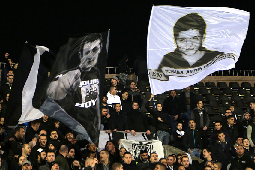 FK Partizan supporters wave flags during a match (Photo: Aubrey Belford)