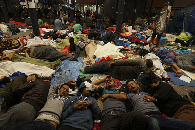 640px-Syrian refugees having rest at the floor of Keleti railway station. Refugee crisis. Budapest Hungary Central Europe 5 September 2015