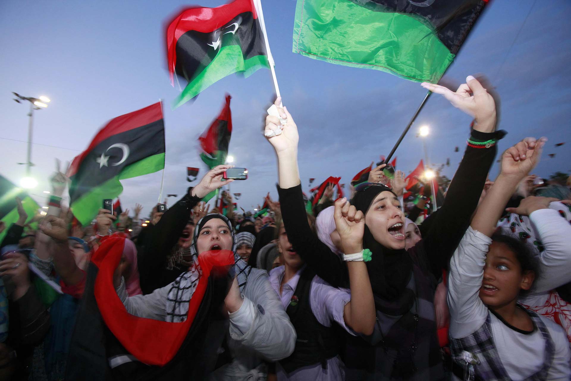 Women celebrate the overthrow of the Gaddafi regime in Misrata, Libya. Credit: Youssef Boudlal / Reuters