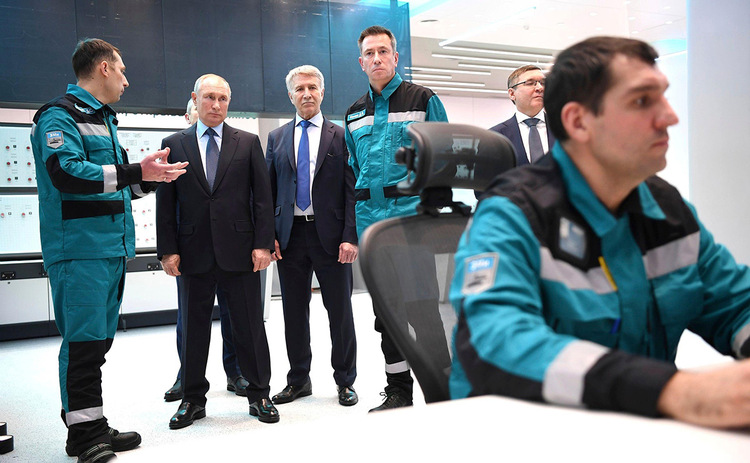 Vladimir Putin and Dmitry Konov tour a petrochemical plant