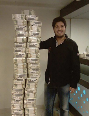 Reza Zarrab stands next to stacks of money
