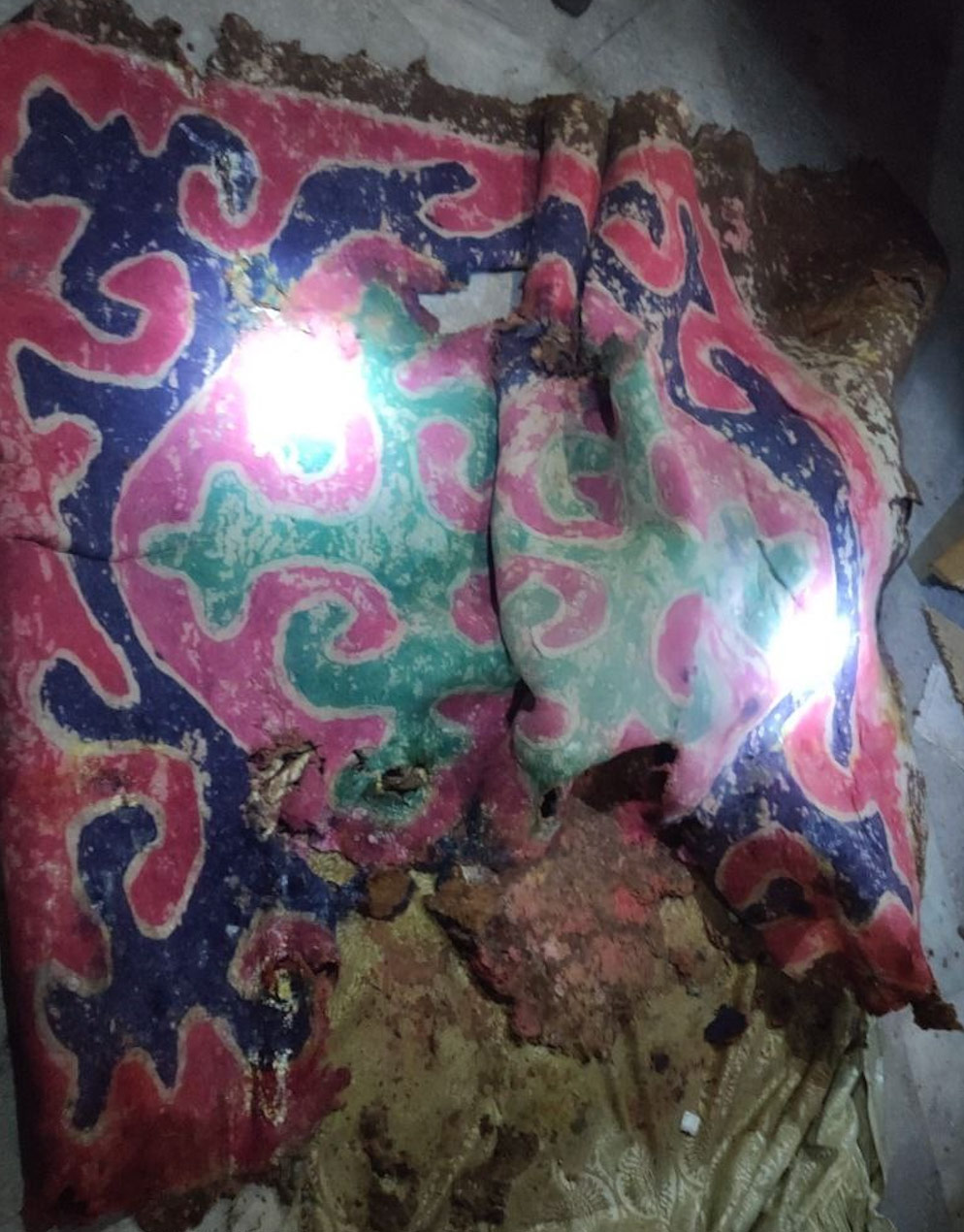 A traditional Kyrgyz rug, called a shyrdak, that was damaged in the fire