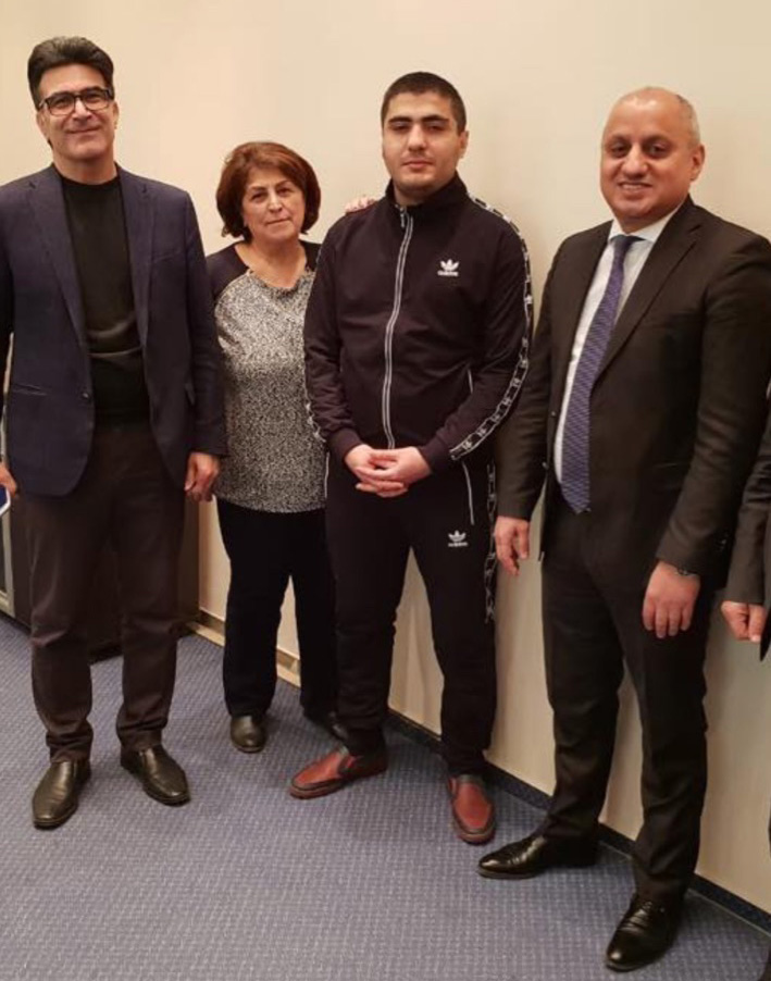 Mehman Huseynov (second from right) pictured with visitors Tuesday. (Photo: Radio Free Europe/Radio Liberty)
