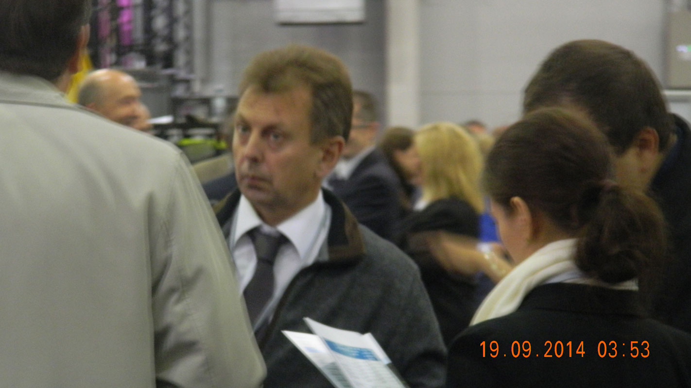 Igor Borisov flanked by his colleagues in the hangar in Edinburgh where the final count took place.