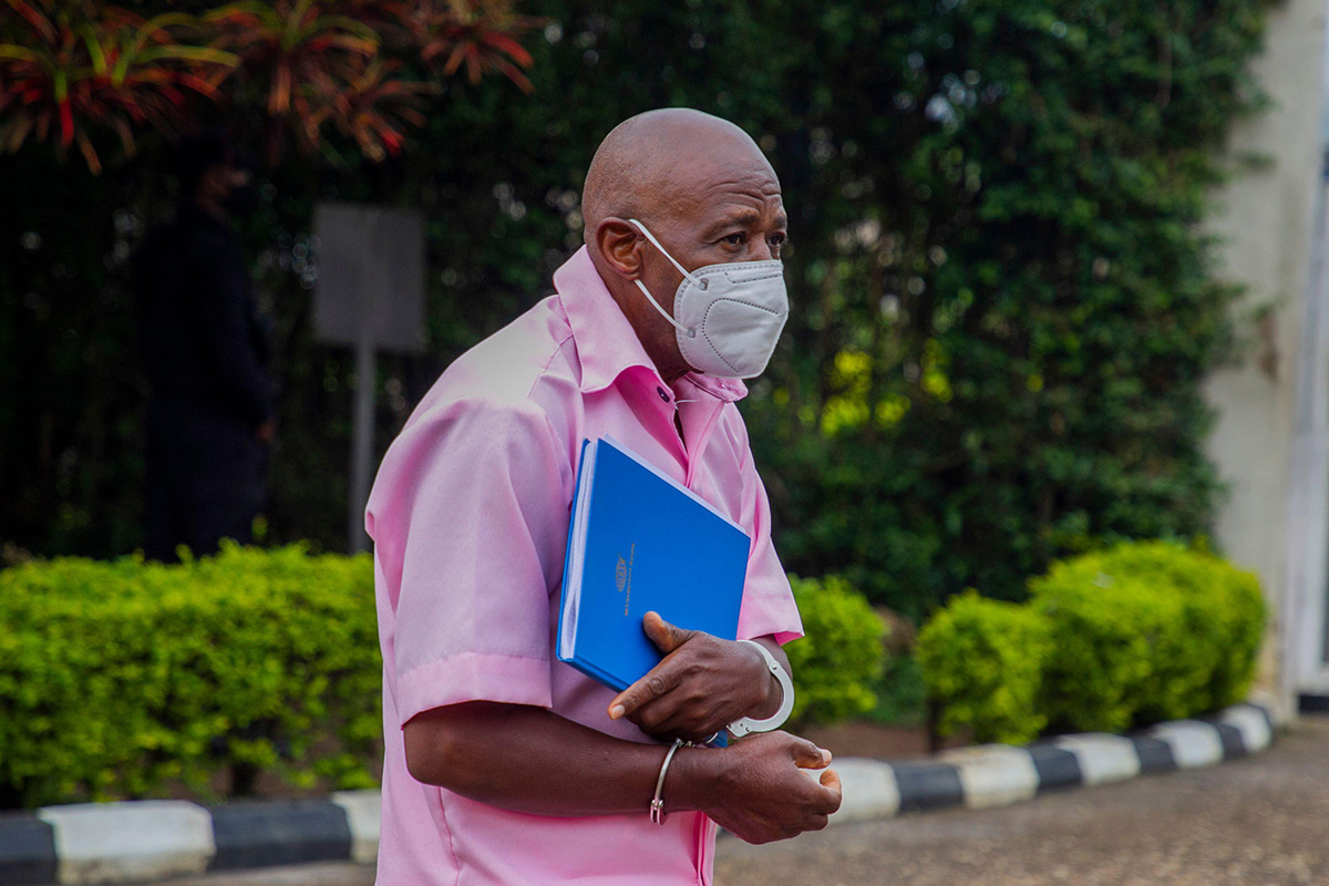 A handcuffed Rusesabagina arrives at a court