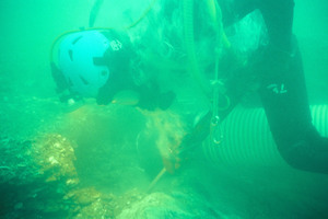 A diver underwater mining the seabed