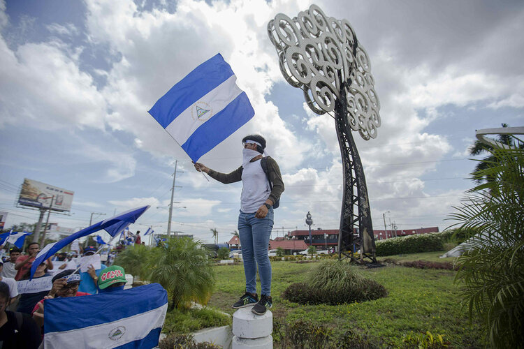 A man holds the Nicaraguan flag