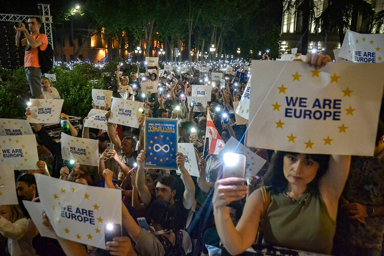 Demonstrators hold placards reading “We Are Europe” during a rally
