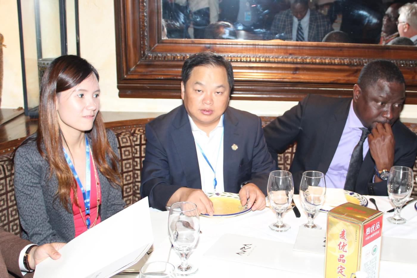 Gina Zhou and Cary Yan sat at a table in a restaurant