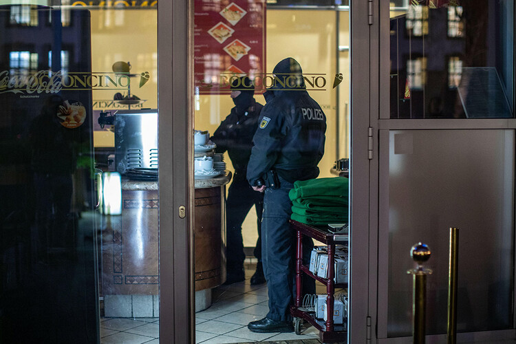 Two policemen are seen inside an ice cream parlor