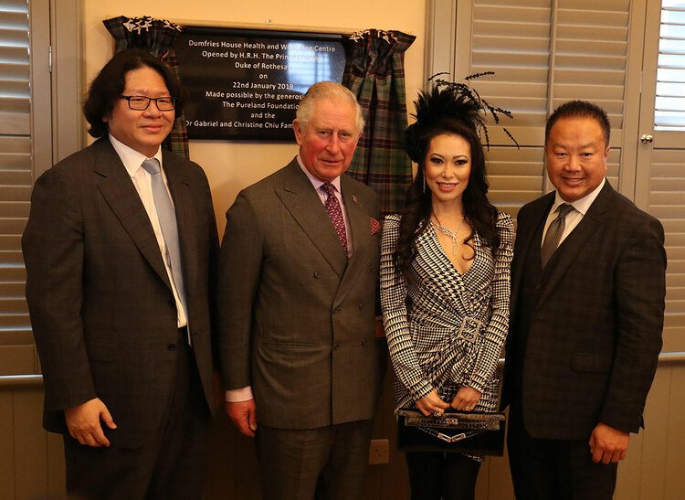 Donors Bruno Wang alongside Dr Gabriel Chiu and his wife Christine as they have their photograph taken with Prince Charles