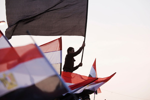 A man waves an Egyptian flag