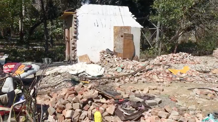 A screenshot of a video showing the rubble where Mohammad and his mother live