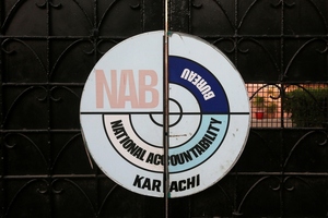 The logo of the National Accountability Bureau (NAB) on the main entrance of its office in Karachi, Pakistan.