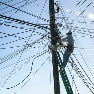 Man works on power lines in Honduras
