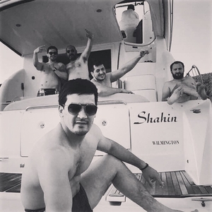 Shamyrat Rejepov and Ukkaşe Çap pose for a photo on a private yacht