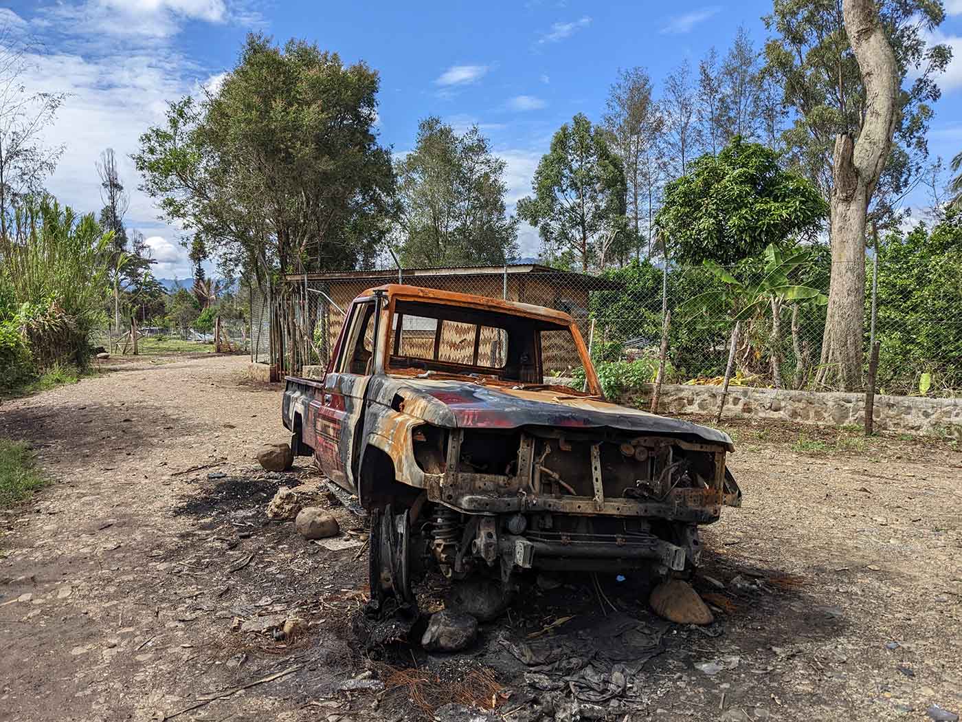 the-pandora-papers/kiniafas-burnt-out-car.jpg