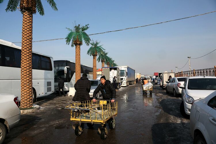 People and vehicles at the Abu Sahiy market