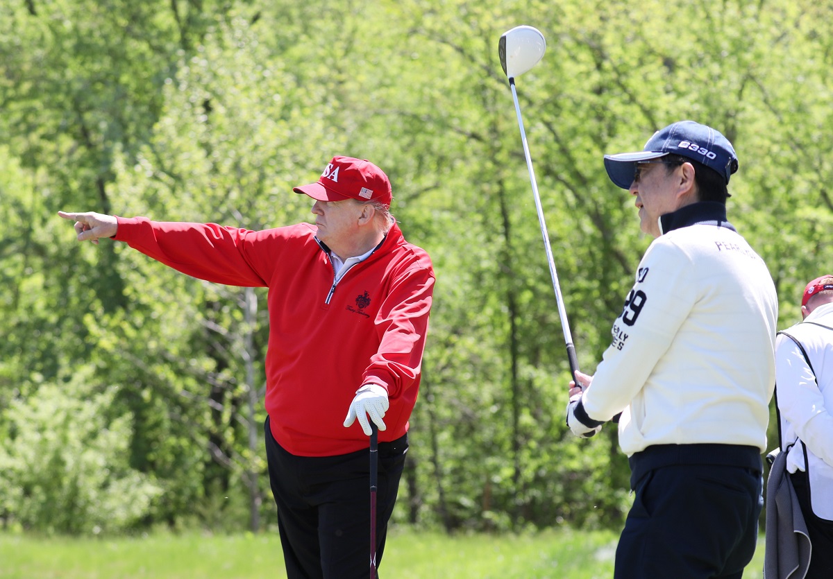 Former U.S. President Donald Trump, pictured with former Japanese PM Shinzo Abe, owns two golf courses in Turnberry and Aberdeen (Credit: 首相官邸ホームページ, CC SA-BY 3.0)
