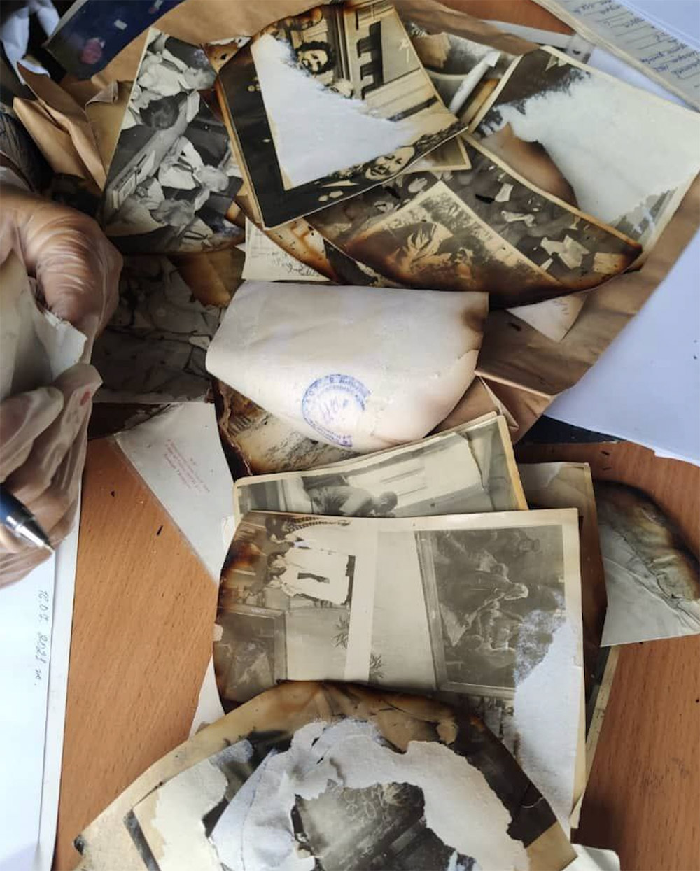 Partially burned historical photographs from the collection