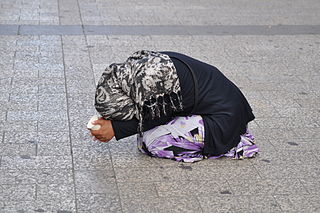 Beggar on the Avenue des Champs Elysees Paris 2010 320px