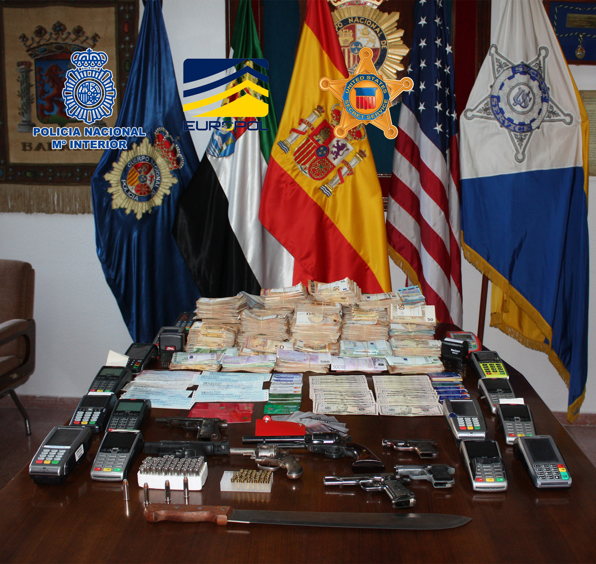 Officers also seized more than 400,000 euros in cash, 14 luxury vehicles, fake identification documents, guns and over 200 bank cards. (Source: Europol)
