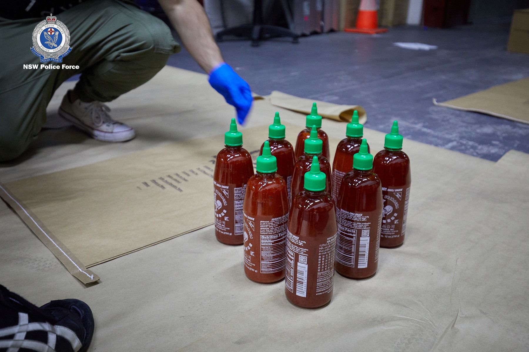 Australian police found hundreds of kilograms of drugs hidden in hot sauce bottles. (Credit: New South Wales Police Force)