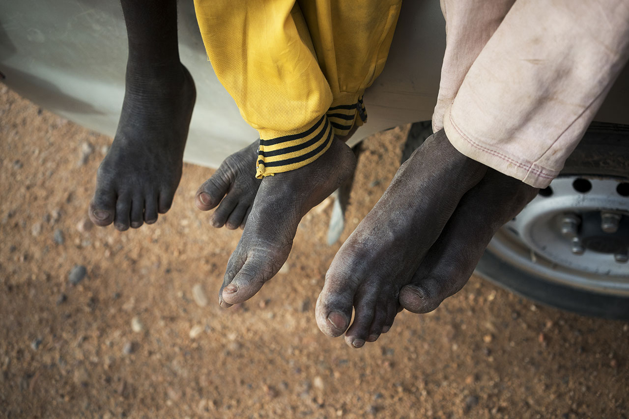 Feet of migrants heading towards Libya. Monday, June 4, 2018. (AP Photo/Jerome Delay)