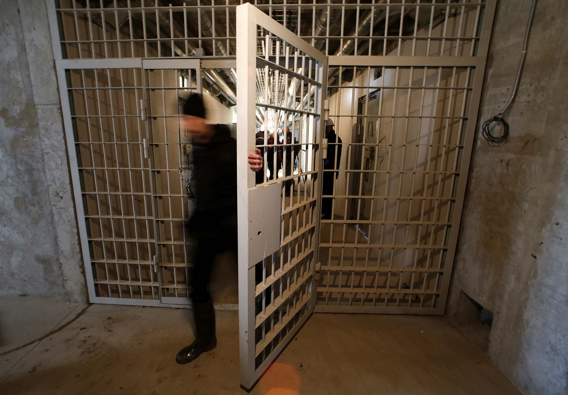 A man walks through a corridor at the Kresy-2 Detention Center outside St. Petersburg, one of the largest prisons in Europe. Credit: Alexander Demianchuk / Reuters