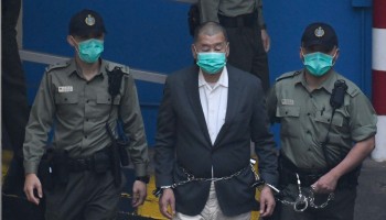 Jailed Hong Kong Activist Denies Charges as “Show Trial” Sparks Global Outrage